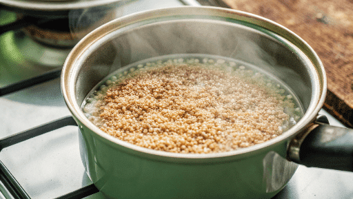 Cooking quinoa in a pot until fluffy