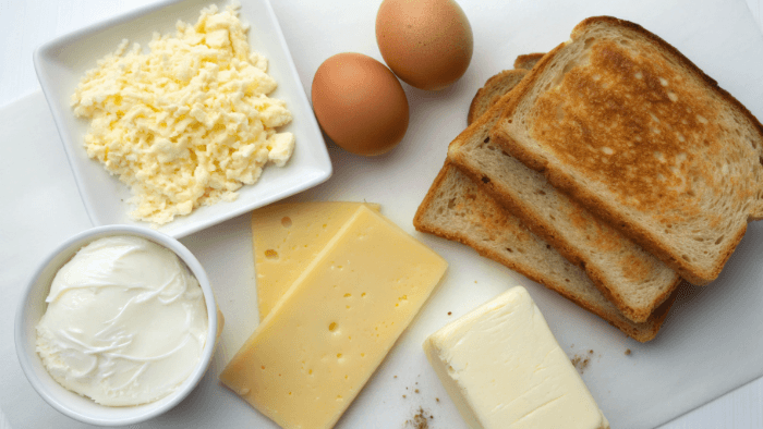 Ingredients for egg and cheese sandwich including egg, bread, and cheese