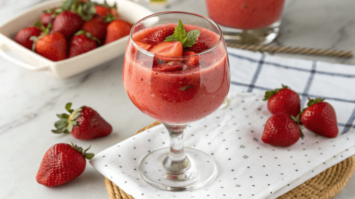 Final strawberry smoothie beautifully served with fresh strawberries