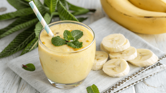 Final creamy banana smoothie served in glass